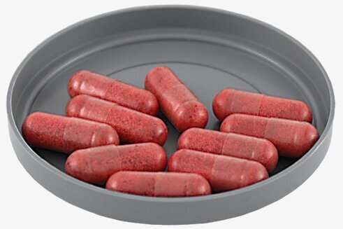 Fyllda Blodkapslar från Grimas på en grå plastbricka