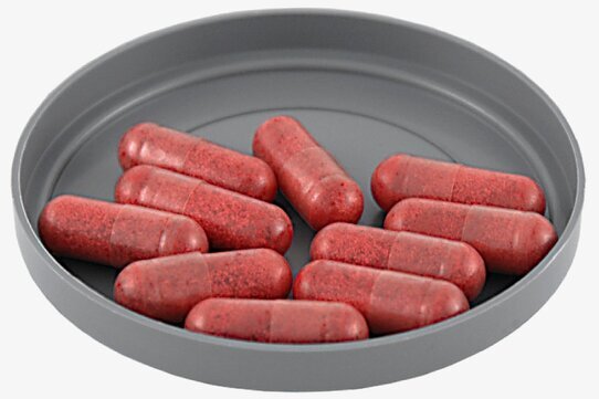 Fyllda Blodkapslar från Grimas på en grå plastbricka